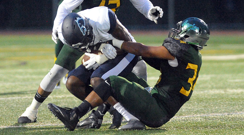 Delaware Valley linebacker Nick Wright sacking Wesley quarterback