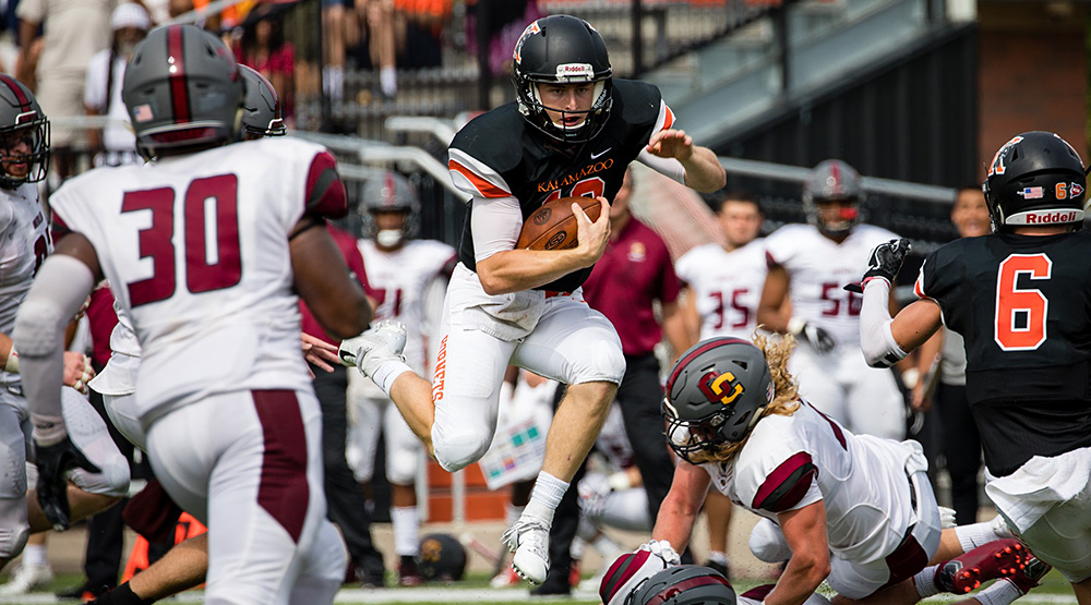 Zach VanFaussien hurdles a Concordia-Chicago defender in an early-season game. (Kalamazoo athletics photo by Kimberly Moss)
